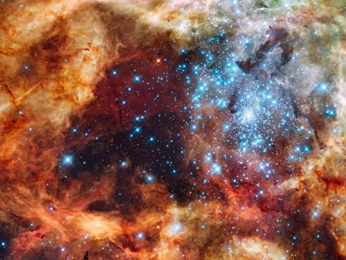 Super star cluster R136 near the center of the Tarantula Nebula in the Large Magellanic Cloud