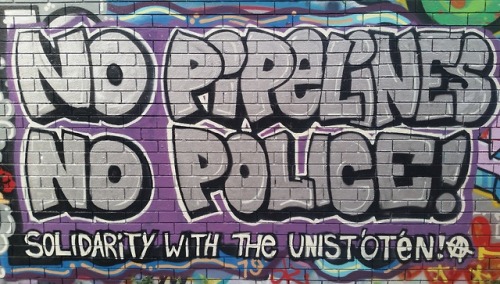 ‘No Pipelines, No Police! Solidarity with the Unist'ot'en!’ Graffiti in Toronto in solid