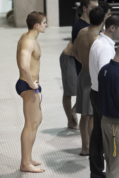 speedoclassics:  A profile shot of a handsome college swimmer looking mighty fine in his classic navy blues. 