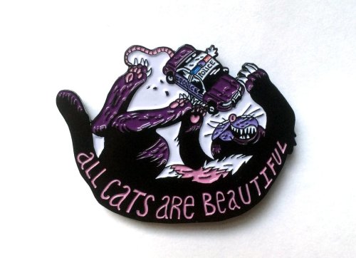 New pressing of Ben Passmore’s “All Cats Are Beautiful” enamel pins, limited to 200 with pink letter