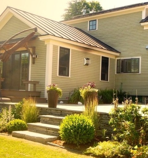 Burlington Roof ExtensionsAn Illustration Of A Medium-sized Traditional Backyard Stone Patio With A Roof