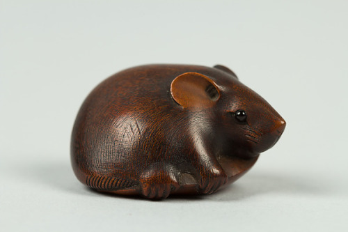 Netsuke of Rat Grasping a Snow PeaJapan, early 19th centuryAbout 1 in high and wide.  The underside 