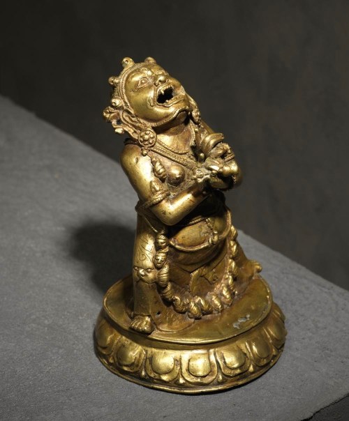 hinducosmos:  Vajradaka Ca 15th-16th century. Tibet. Copper alloy. Height 14.5 cm Rare representation of the deity traditionally depicted crouching on a lotus in full bloom, hands crossed in front of the chest, holding the bell and vajra, head raised.