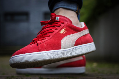all red pumas suede on feet