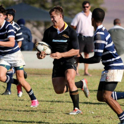 Strong school rugby boy with huge feet and bodybuilder body.