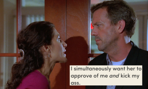 Greg House and Lisa Cuddy stand close, facing each other in profile. They have a charged, playfully antagonistic air between them. Below House's chin is a screenshot text post that reads: "I simultaneously want her to approve of me and kick my ass."
