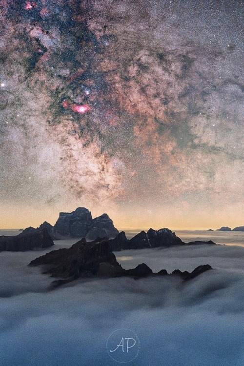 Captured Here In This Picturesque Photo, Mountain Peaks In Northern Italy Poke Through Earth’s Water