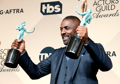 tepitome:  mcavoys:     Idris Elba, winner of the Outstanding Performance by a Male Actor in a Supporting Role award for ‘Beasts of No Nation’ and Outstanding Performance by a Male Actor in a Television Movie or Miniseries award for ‘Luther,’