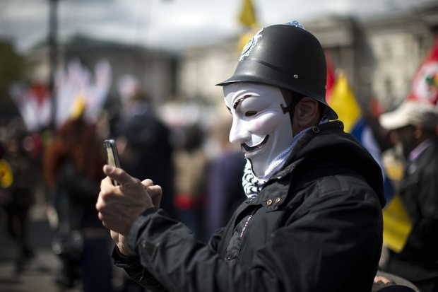 theredhairing40:  MATT DUNHAM/ASSOCIATED PRESS A protester wearing a toy British