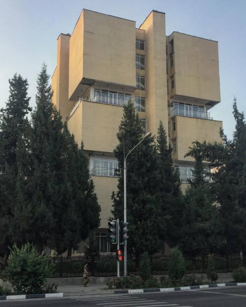 : . main facade, former computing center of Tajik Ministry of Automobile transport, designed byvatch