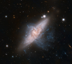 just&ndash;space:  Two galaxies, that look as if they are colliding, but are actually separated by tens of millions of light-years, about 10 times the distance between the Milky Way and the neighboring Andromeda galaxy  js 