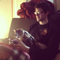 ginny likes to snuggle dylan while he plays #skyrim