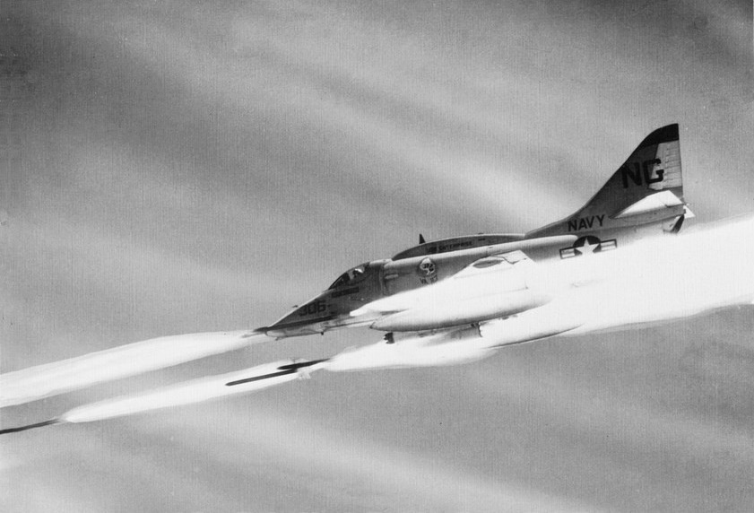 ironwarriors:  Zuni missiles streak from the wings of an A-4 Skyhawk as it supports