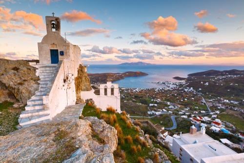 Rosy ☀️Church of Panagia Paraportiani at sunrise in Mykonos island. Photo by olgacov.View of Serifos