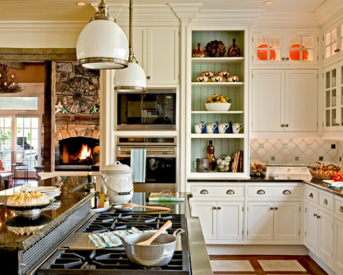 Painted beadboard makes a bookshelf stand out in a coastal-inspired kitchen.