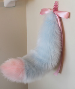 kittensplaypenshop:  Funny photo (looks like a wall mount of some sort? hehe) but here’s the cotton candy fox tails with detachable plug and fully wired so you can pose it any way you’d like! :) 