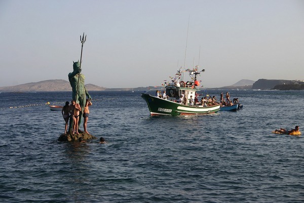 sixpenceee:  A wave engulfs the statue of Neptune on Melenara Beach, Gran Canaria