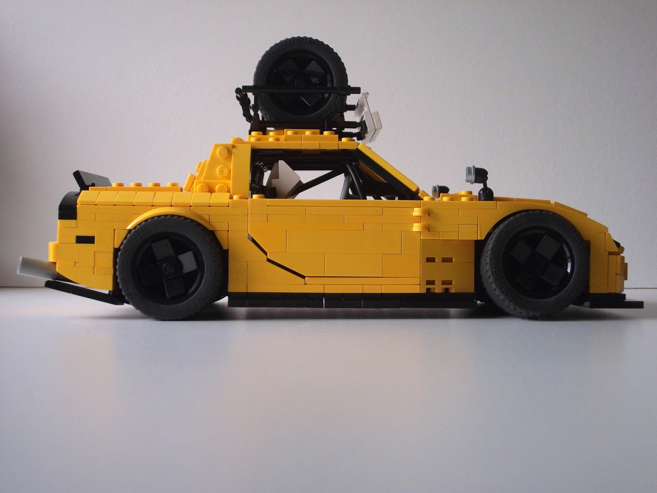 enjoycarlife:  swedishllama:  My LEGO 1990 Mazda RX-7. Whore’d out by yours truly.