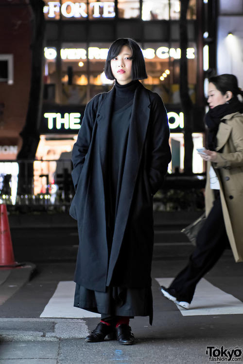 19-year-old Moeno on the street in Harajuku wearing a dark look including a Christophe Lemaire maxi 