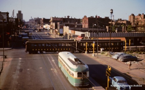 A CTA test train on Van Buren passes by CTA PCC 4385 on Western avenue in 1953. (Photo by William C.