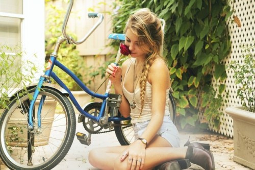blue bike and pretty flower girl