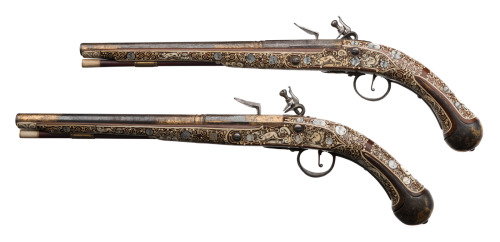 A pair of bone inlaid flintlock pistols originating from Silesia, 18th century.