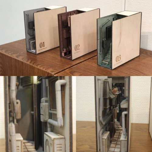 itscolossal:Miniature Installations Transform Bookshelves into the Back Alleys of Japan