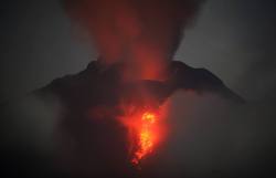 untrustyou:  Mount Sinabung spews lava and gas during an eruption viewed from Jeraya, North Sumatra, Indonesia on January 20, 2014 AP Photo/Binsar Bakkara