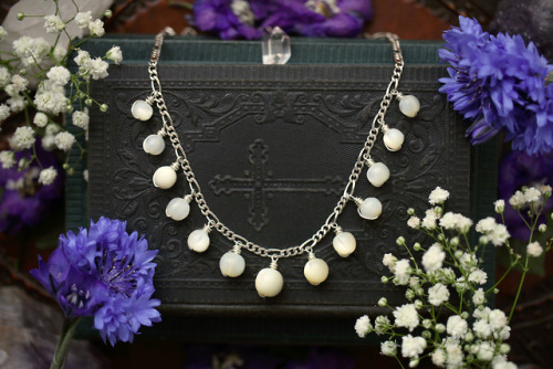 Antique white rosary mother of pearl beads made into an elegant sterling silver necklace.Available a