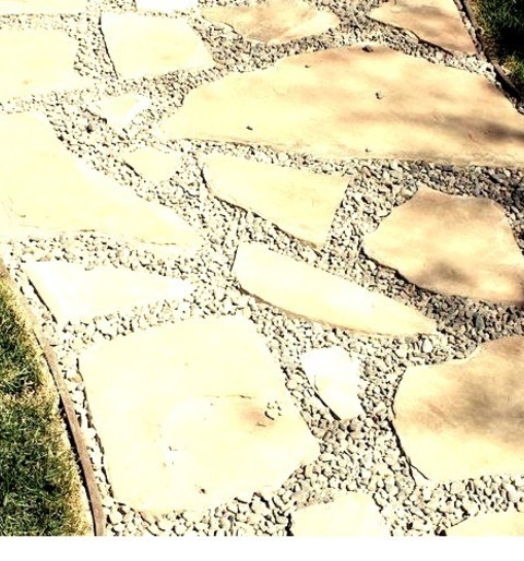 Landscape - Natural Stone PaversPhoto Of A Mid-sized Full Sun Backyard Stone Landscaping In Spring.
