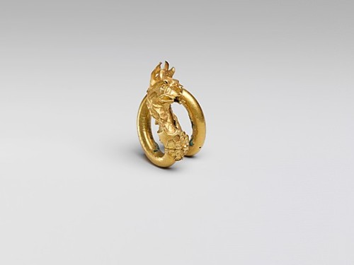 ancientpeoples:  Gilded bronze spiral It was either an earring or hair adornment. It shows an erect 