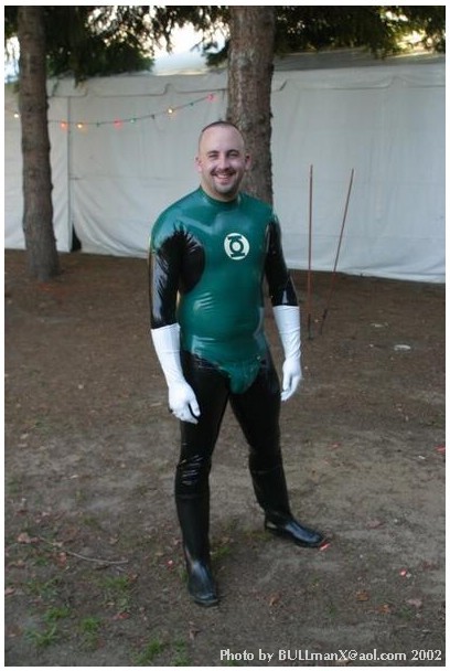 2manykinks:  rubbergloved:  The Green Lantern latex costume made by Chris may british designer  Reddy is SO cute as a rubber GL … tho I really wanted to see him get worked over by a villain.  ;)  Still, can’t beat white rubber gloves for maximum