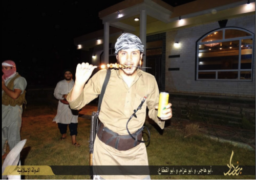 An IS Fighter Wearing A Suicide Belt Enjoys A Kebab And Soda - September, 2014