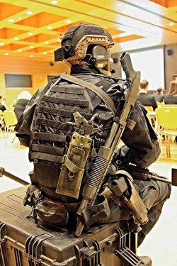 gunrunnerhell:  Down time… A member of Poland’s Special Forces unit JWK. Note the A-TACS LE camouflage clothing. Generally JWK uses Multicam or A-TACS AU in Afghanistan. (GRH) 