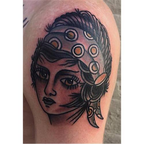 A cute little traditional lady head by Nicholas G.