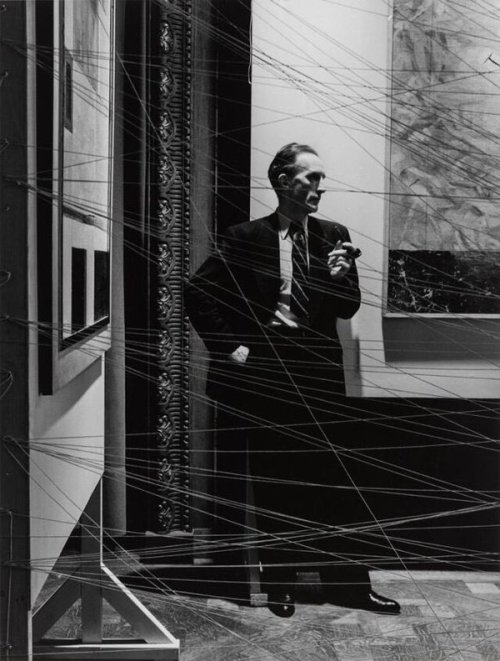 24hoursinthelifeofawoman: Marcel Duchamp behind his installation of “Sixteen miles of string”. ⁰New 