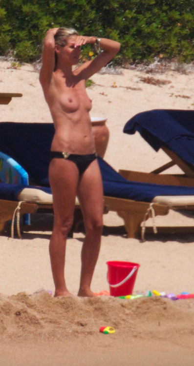 toplessbeachcelebs:  Heidi Klum (Model) sunbathing topless in Sardinia (August 2011) - Part I