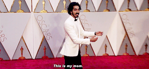ageofultron:Dev Patel and his mom Anita arrive adult photos