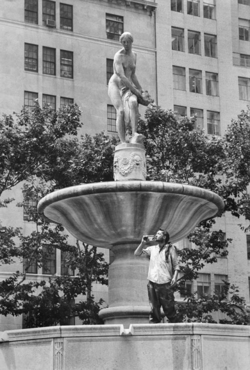 July 17, 1969: Poetic images conjuring a lazy summer at Grand Army Plaza in Manhattan contrasted wit