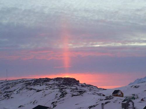 Sun pillar over KulusukSun pillars or light pillars are vertical rays of light caused by the reflect