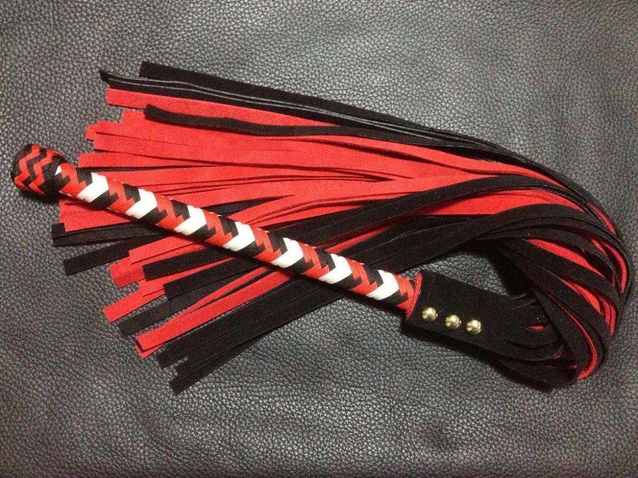 bdsmgeek:  edgeplay-co-uk:  Harley Quinn themed whip and flogger. Only one of each