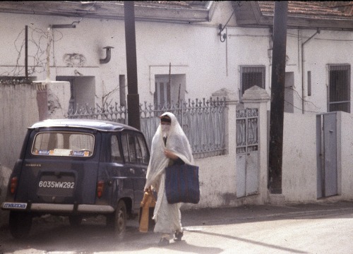 lounesmatoub:Algeria: A Renault 4 and a Veiled Woman - Algiers 1983