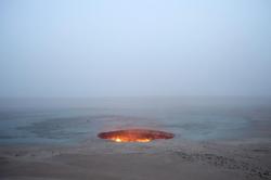houses-of-wolves:    Turkmenistan’s “Door to Hell”More than four decades ago, a gaping, fiery crater opened up in the desert of northern Turkmenistan (map), likely the result of a drilling mishap.The Darvaza Crater, more commonly known as the Door