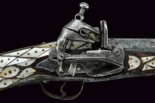 Miquelet musket decorated with silver and pearl panels.  Originates from the Balkans, 19th century.