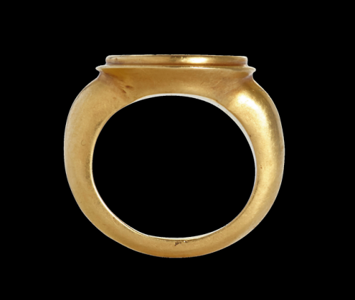 Ancient Roman gold ring with a carnelian intaglio of the gods Asclepius and Hygeia, dated to the 2nd