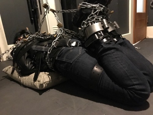 seabondagesadist: The “rest” for @lostinsea88 didn’t last all that long before I decided that it was simply not enough bondage and needed correction. A modified straightjacket hogtie was called for.  His legs pulled up and locked to chains around