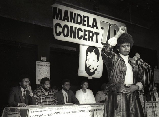specialnights:
“Winnie Mandela raises her fist in a black power salute after announcing that a massive pop concert will be held to mark the 70th birthday of her husband, July 17, 1988.
”