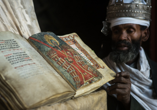 Ethiopian orthodox priest with a manuscript, in Na'akuto La'ab church, Lalibela, Ethiopia. [x]T