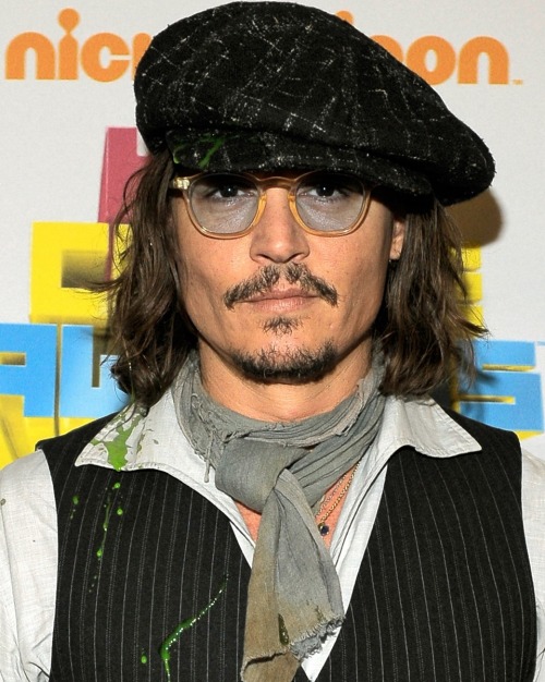 Johnny Depp, 11 years ago, on April 2, 2011 holding his orange blimp award after winning on the &ldq