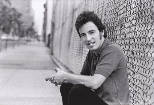 Bruce at the schoolyard fence, NY, August 1979 by Joel Bernstein